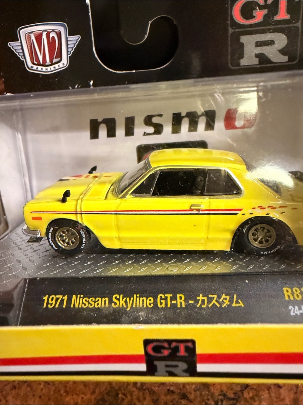 M2 Machines Yellow 1971 Nissan Skyline GT-R Toy Car with Red Stripe